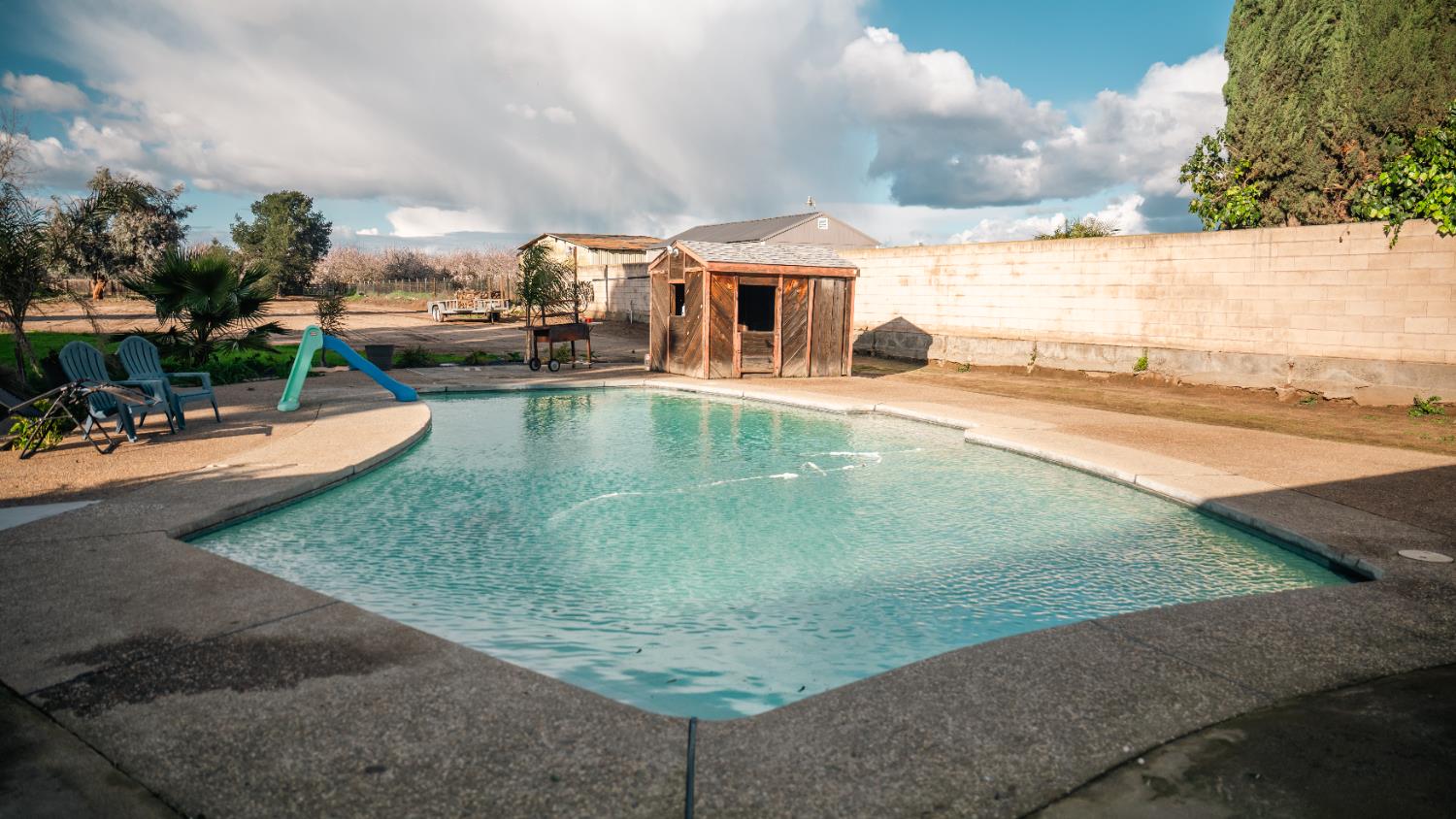 9115 East Southland Road Manteca, CA 95336 - Photo 31 of 52 an outdoor space with swimming pool and furniture