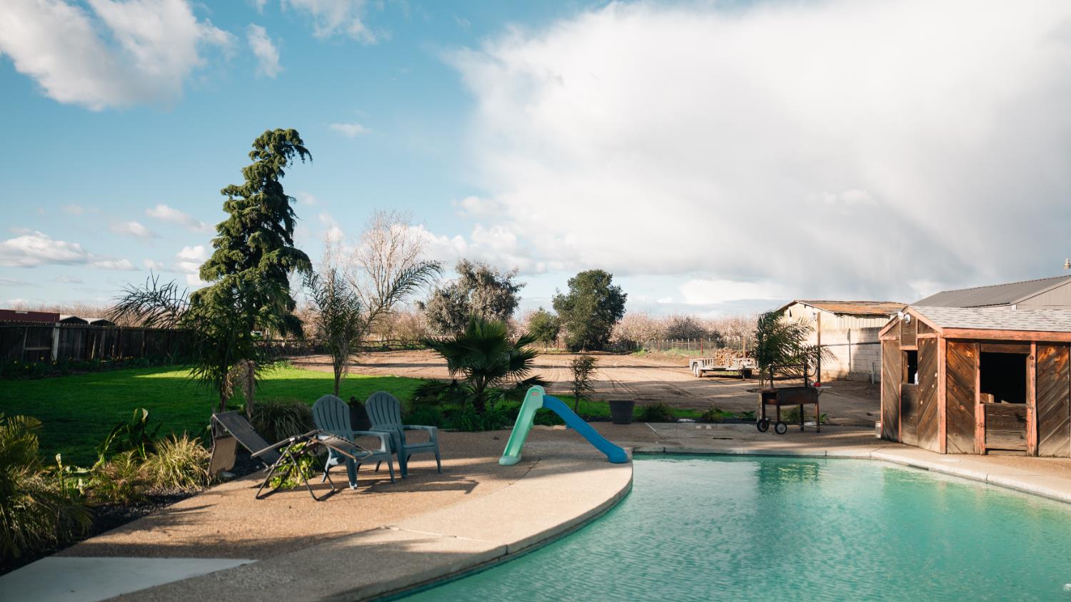 9115 East Southland Road Manteca, CA 95336 - Photo 34 of 52 a view of a park with swings and slides