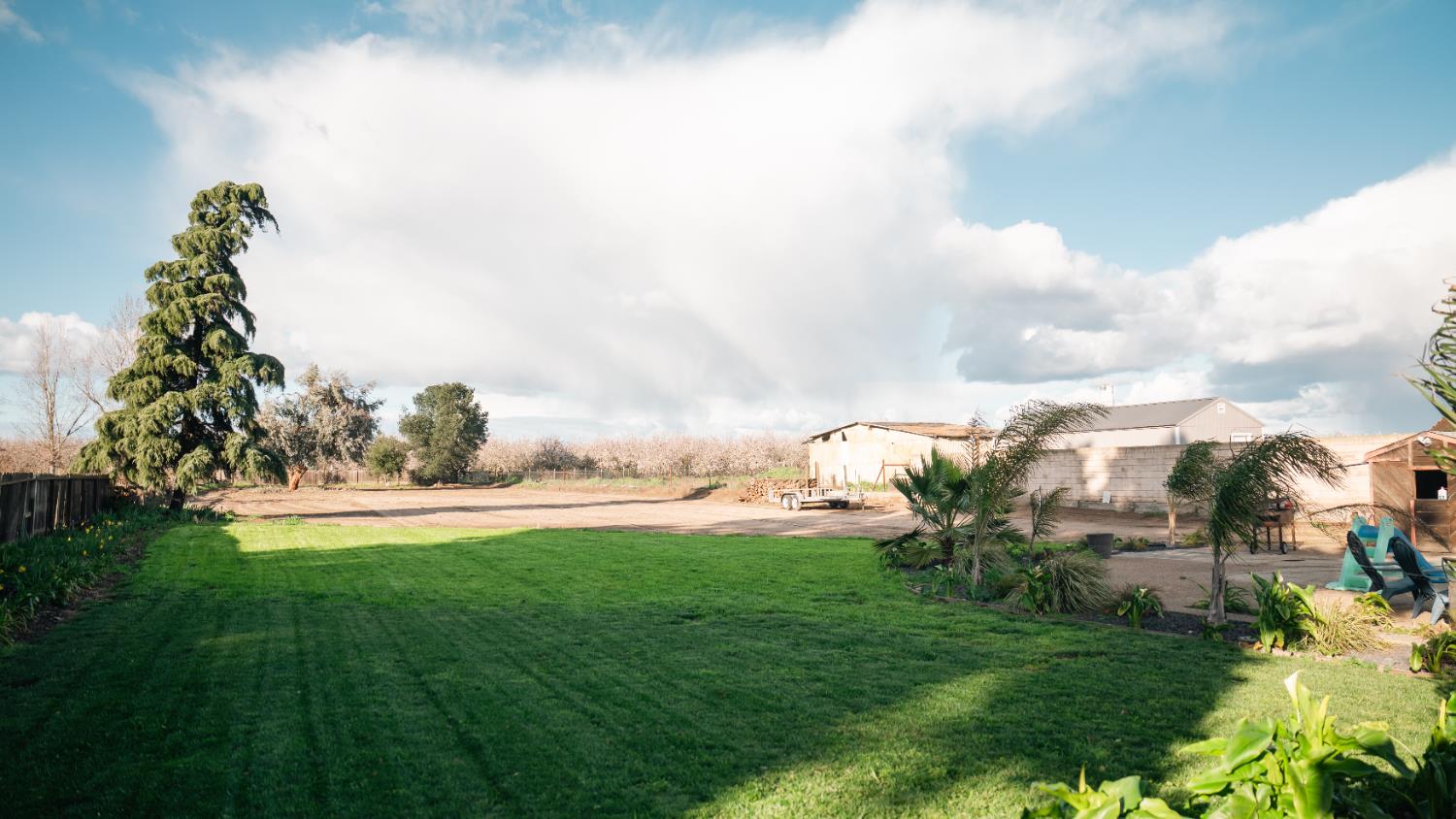 9115 East Southland Road Manteca, CA 95336 - Photo 36 of 52 a backyard of a house with lots of green space