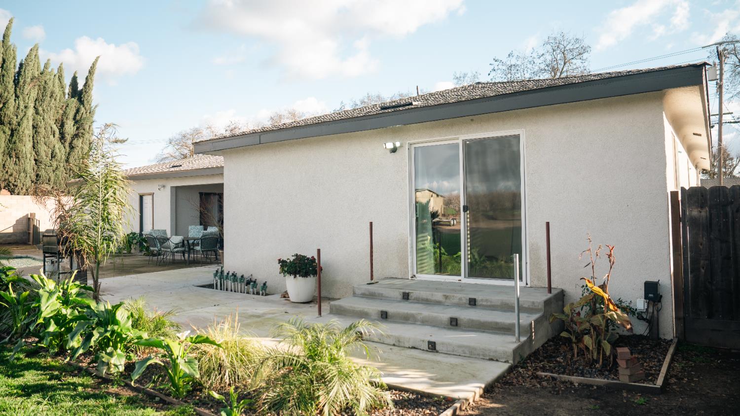 9115 East Southland Road Manteca, CA 95336 - Photo 37 of 52 a front view of a house with garden