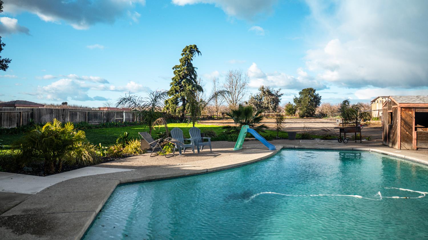 9115 East Southland Road Manteca, CA 95336 - Photo 46 of 52 a view of a swimming pool with a patio