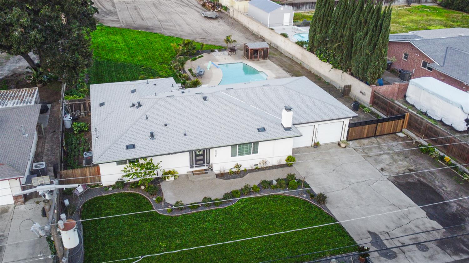9115 East Southland Road Manteca, CA 95336 - Photo 50 of 52 an aerial view of a house with a yard