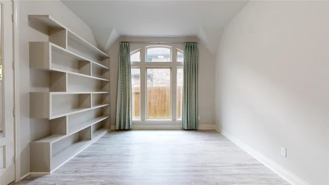 a kitchen with granite countertop cabinets and stove