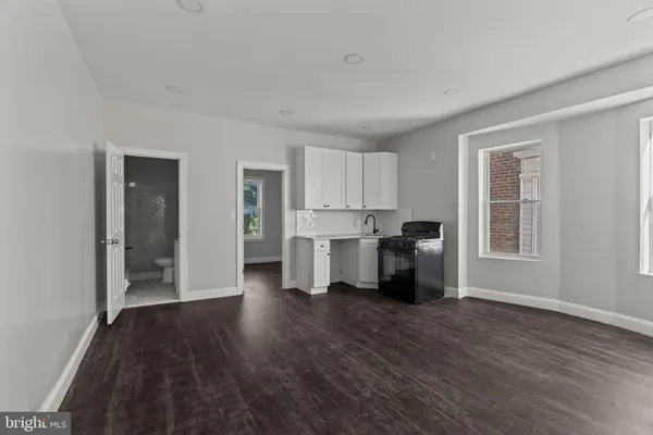 a view of a kitchen with wooden floor