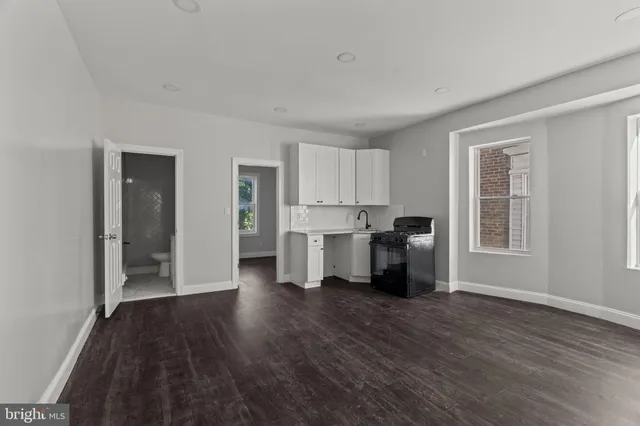 a view of a kitchen with wooden floor