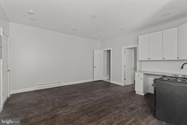a kitchen with stainless steel appliances granite countertop a stove and a refrigerator