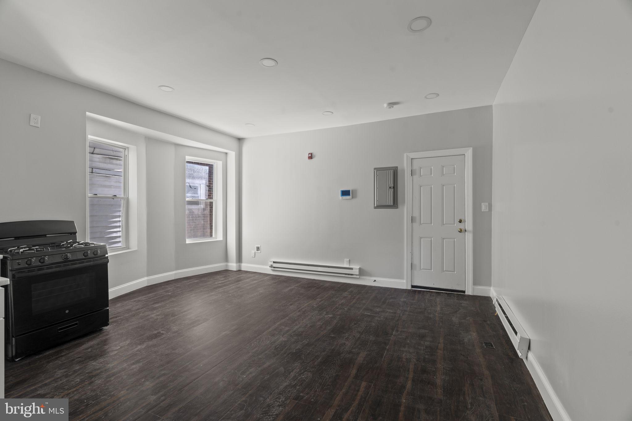 5237 Chester Avenue, Unit 3 Philadelphia, PA 19143 - Photo 21 of 35 wooden floor in an empty room