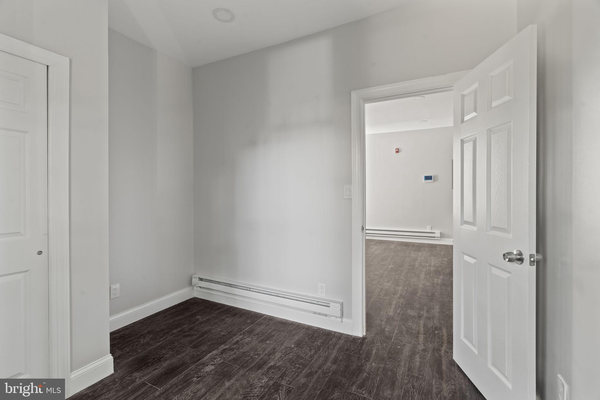 5237 Chester Avenue, Unit 3 Philadelphia, PA 19143 - Photo 24 of 35 wooden floor in an empty room