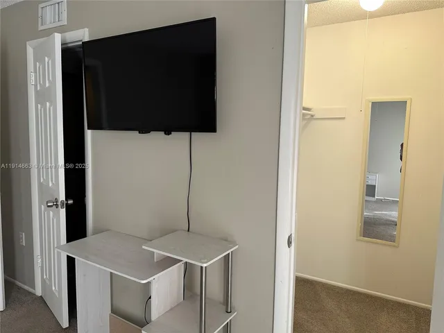 a kitchen with a counter top space and stainless steel appliances