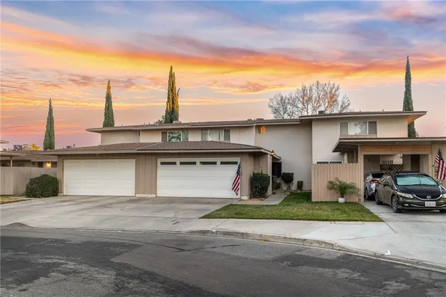 a view of a car park in front of a house