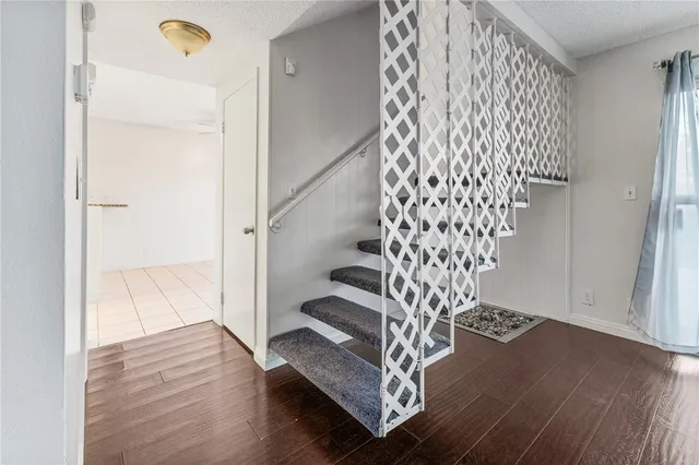 a view of entryway with wooden floor