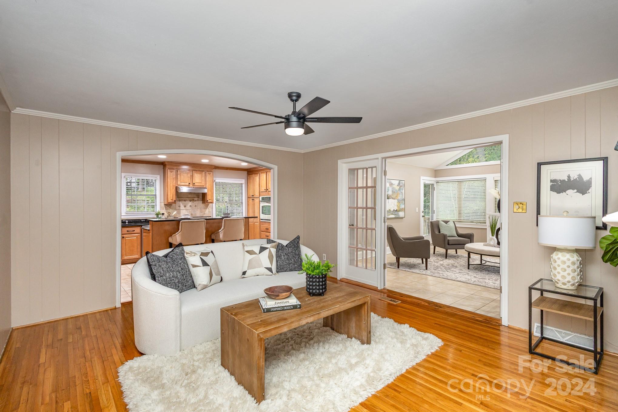 4011 Chandworth Road Charlotte, NC 28210 - Photo 11 of 30 a living room with furniture and a large window with wooden floor