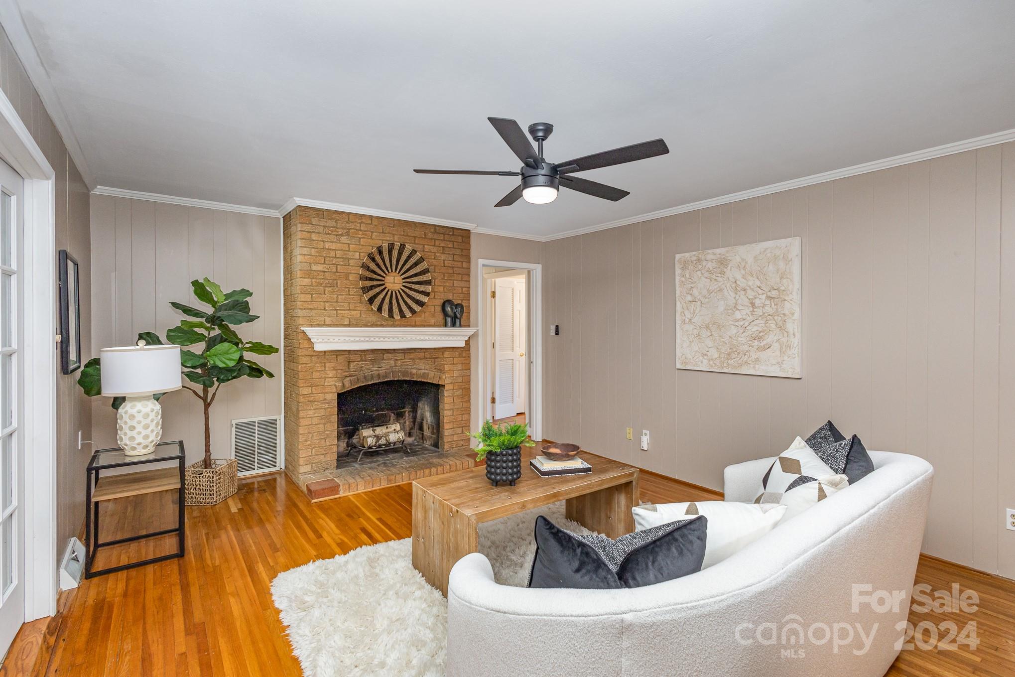 4011 Chandworth Road Charlotte, NC 28210 - Photo 12 of 30 a living room with furniture and a fireplace