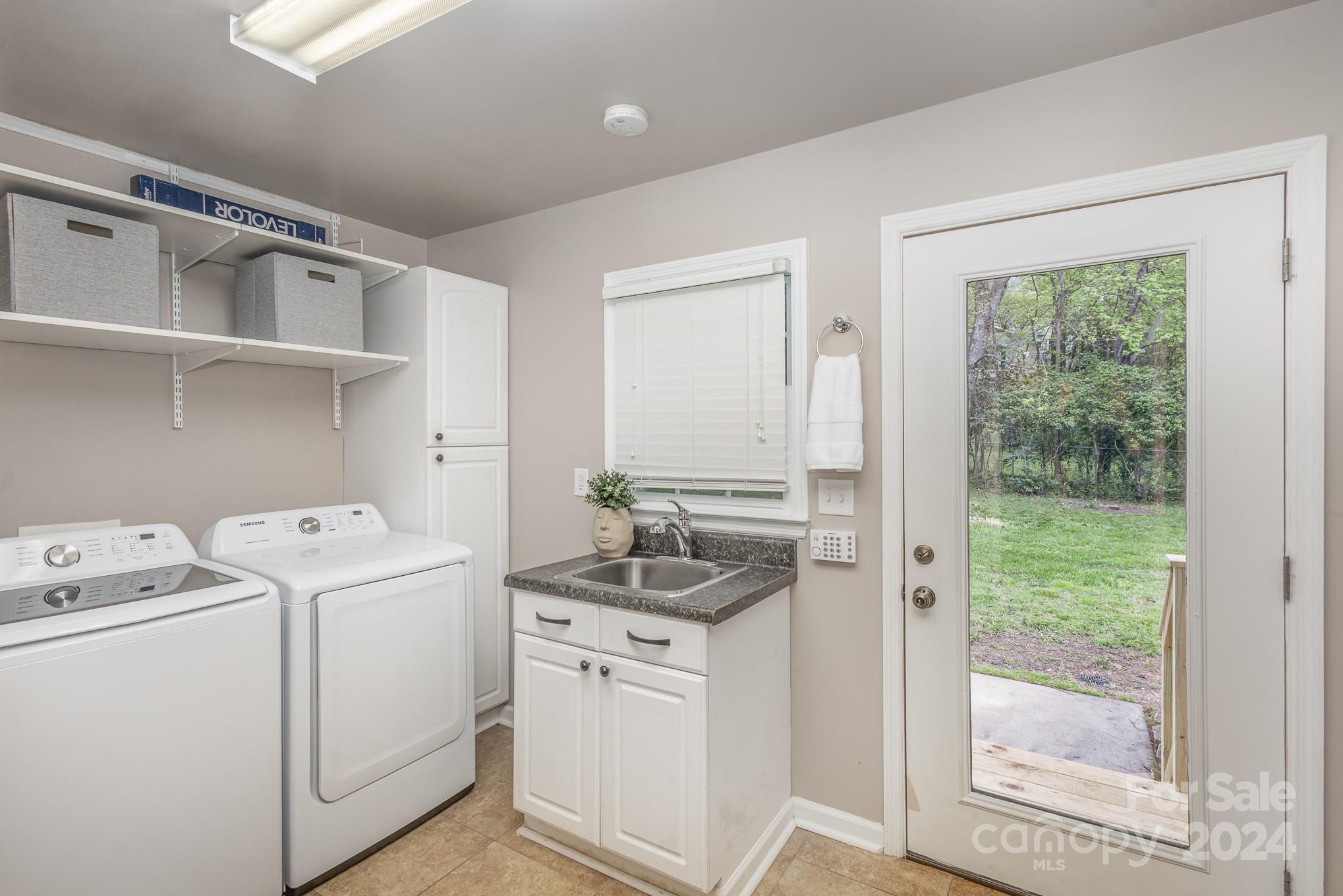 4011 Chandworth Road Charlotte, NC 28210 - Photo 24 of 30 a room with dryer and washer
