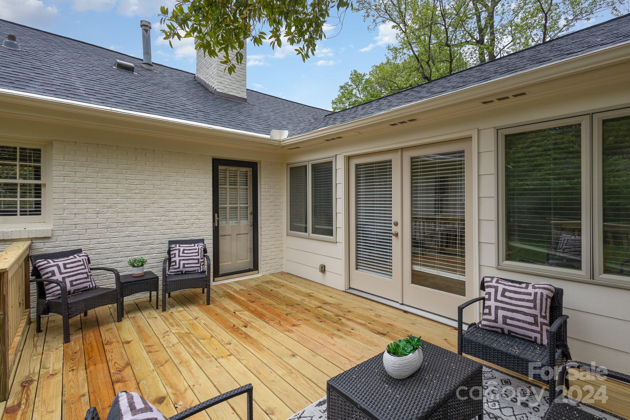 4011 Chandworth Road Charlotte, NC 28210 - Photo 25 of 30 a view of a patio with couple of chairs and a potted plant