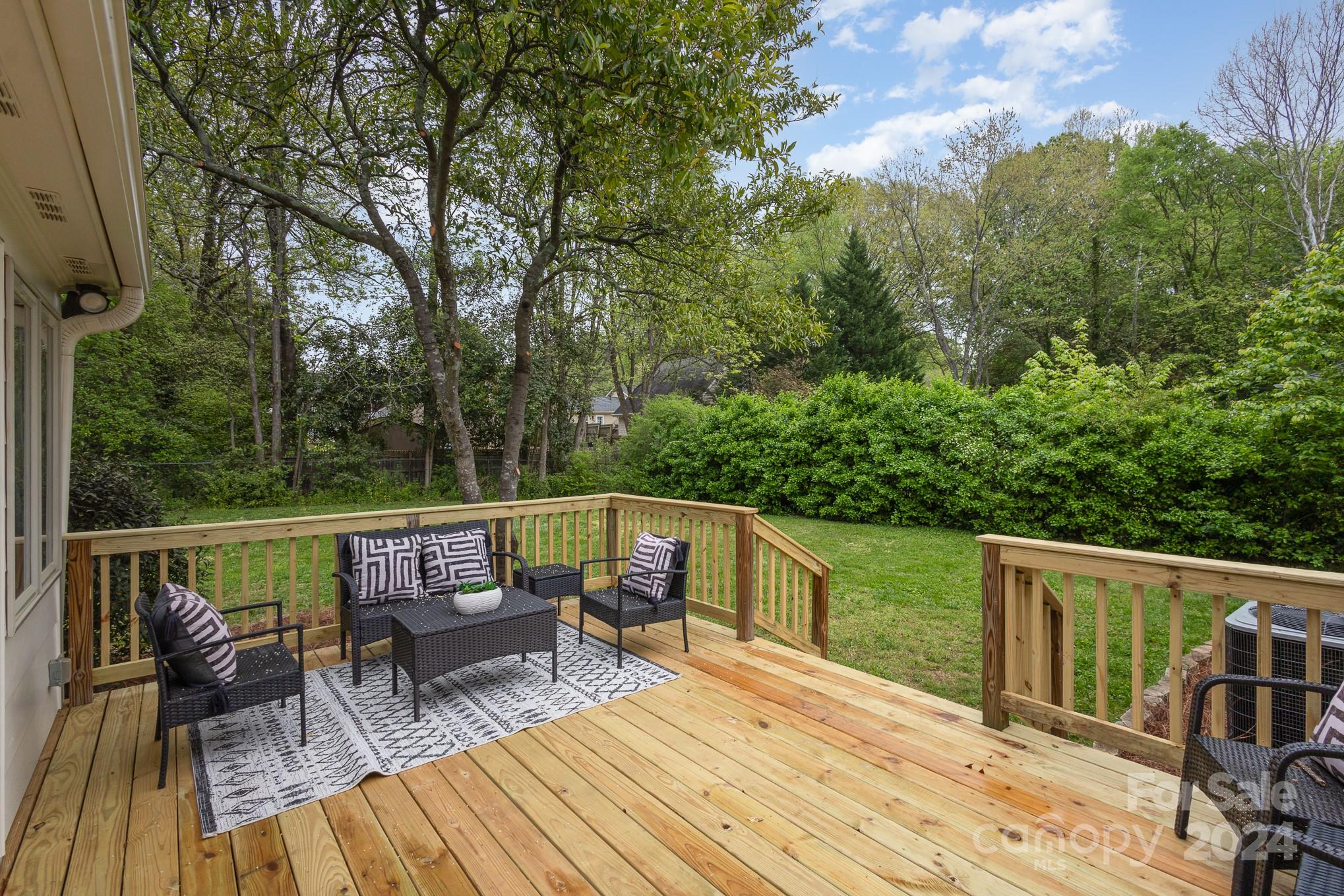 4011 Chandworth Road Charlotte, NC 28210 - Photo 26 of 30 a view of balcony with furniture and trees