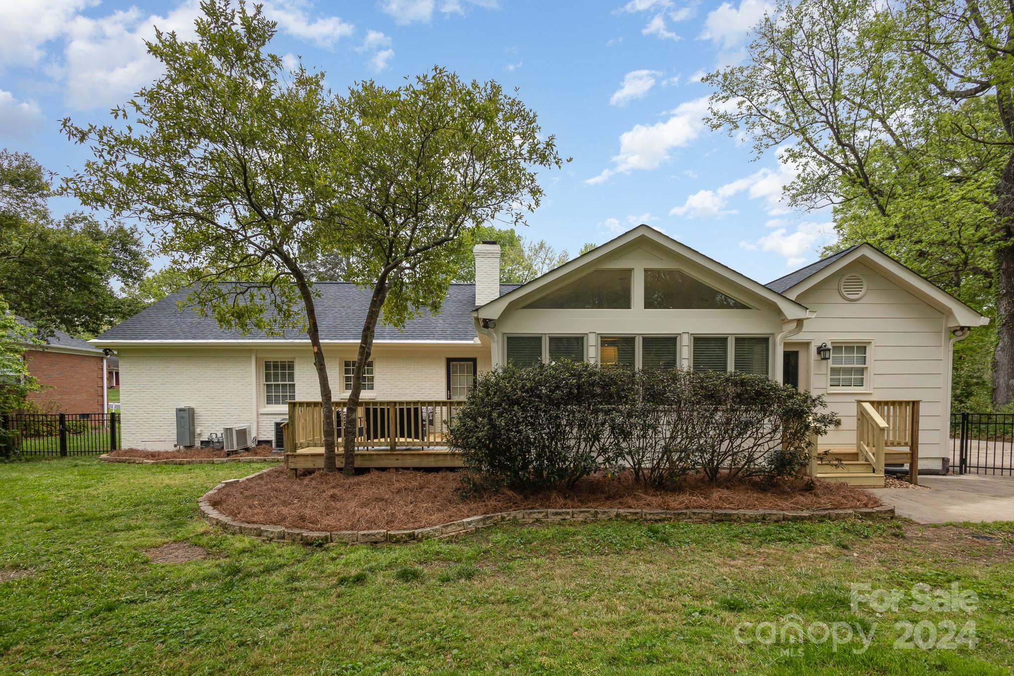 4011 Chandworth Road Charlotte, NC 28210 - Photo 29 of 30 a front view of a house with a yard