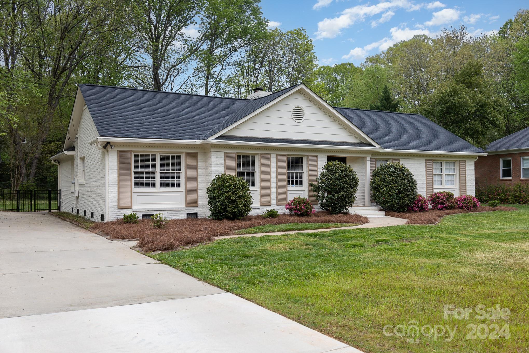 4011 Chandworth Road Charlotte, NC 28210 - Photo 30 of 30 a front view of a house with a yard