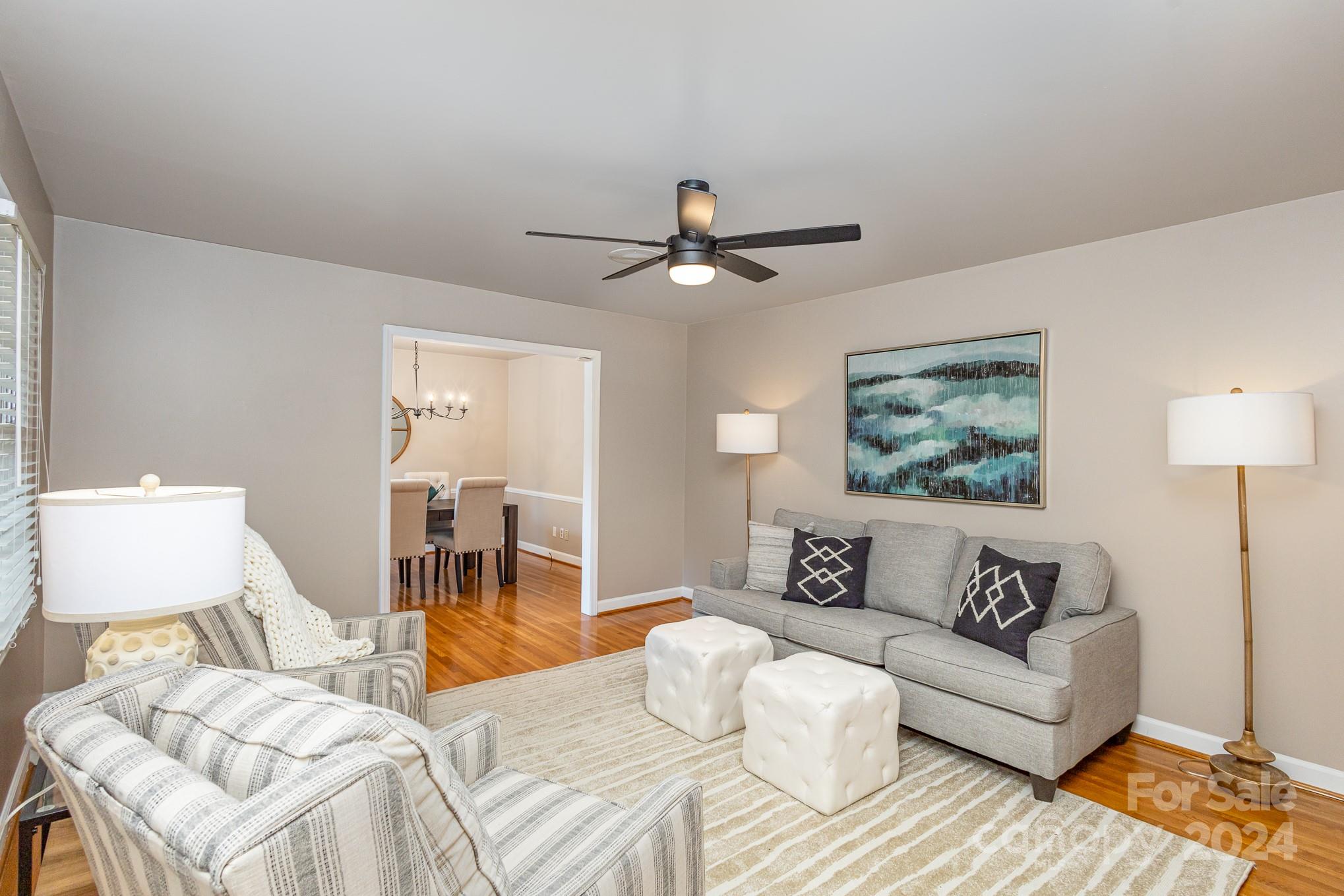 4011 Chandworth Road Charlotte, NC 28210 - Photo 5 of 30 a bedroom with a bed and a couch