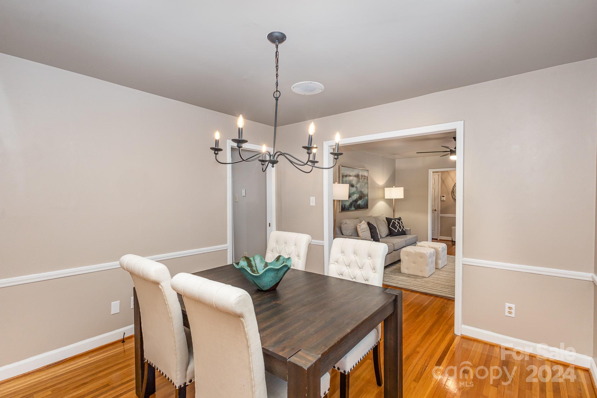 4011 Chandworth Road Charlotte, NC 28210 - Photo 7 of 30 a view of a dining room with furniture and wooden floor