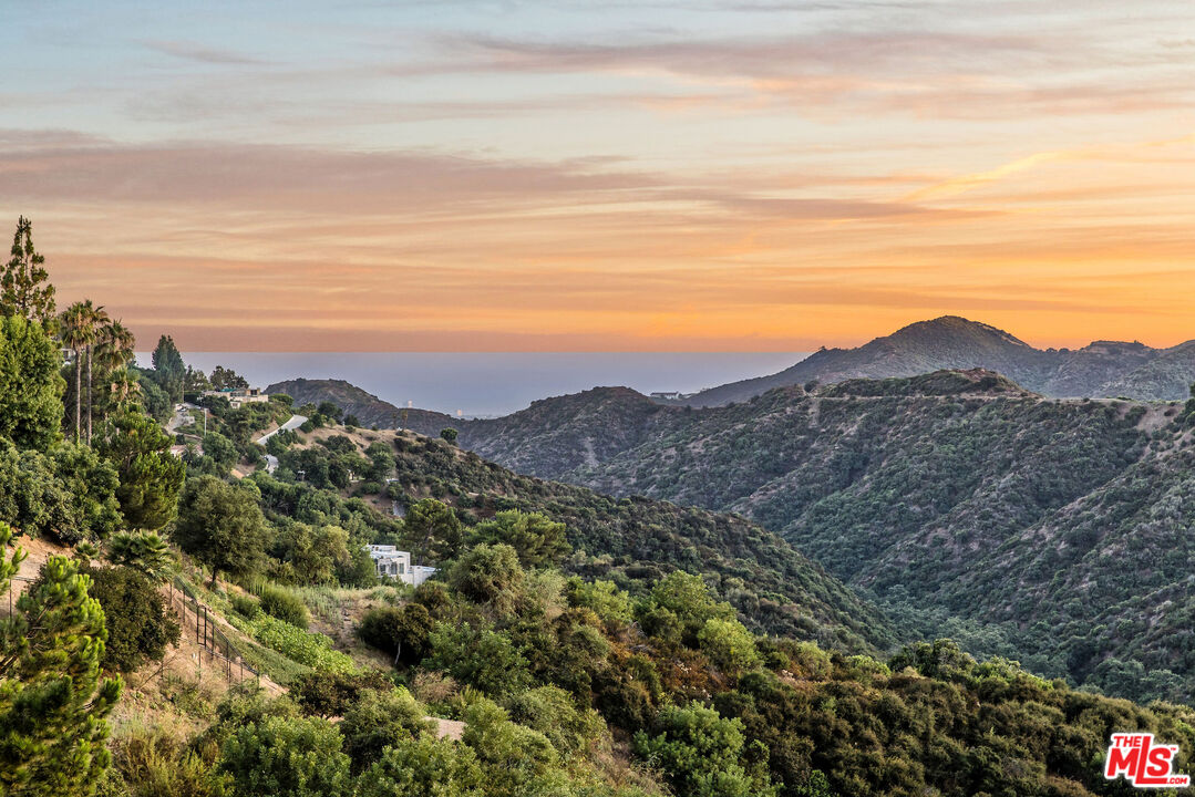 2385 Roscomare Road, Unit F4 Los Angeles, CA 90077 - Photo 1 of 57 a view of a large mountain with mountains in the background