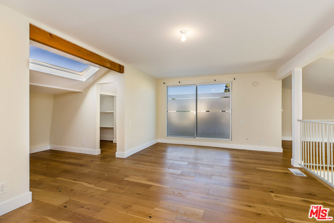 2385 Roscomare Road, Unit F4 Los Angeles, CA 90077 - Photo 21 of 57 a view of empty room with wooden floor