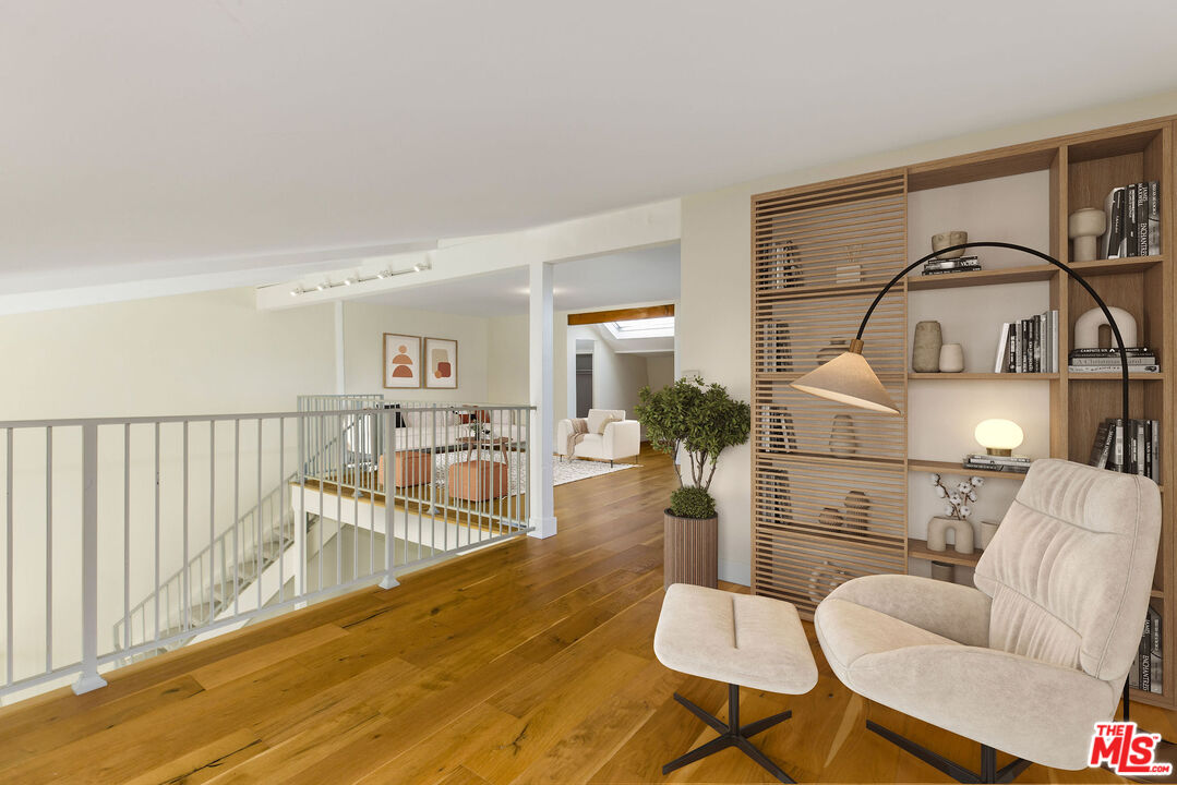 2385 Roscomare Road, Unit F4 Los Angeles, CA 90077 - Photo 24 of 57 a living room with furniture a wooden floor and a sink