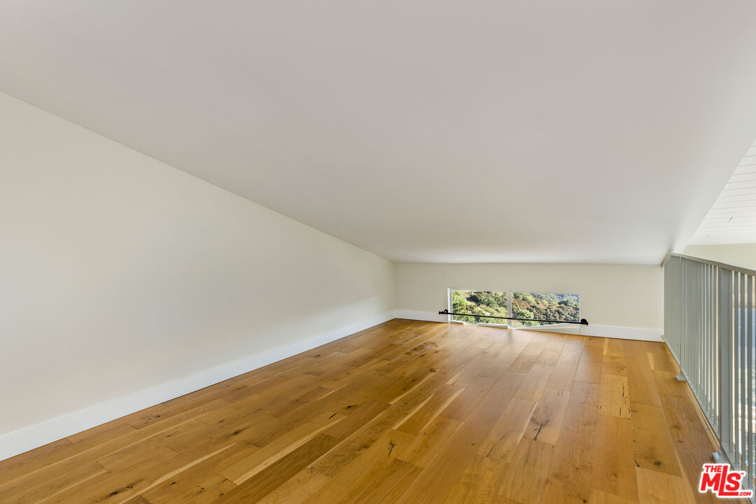 2385 Roscomare Road, Unit F4 Los Angeles, CA 90077 - Photo 25 of 57 a view of empty room with wooden floor