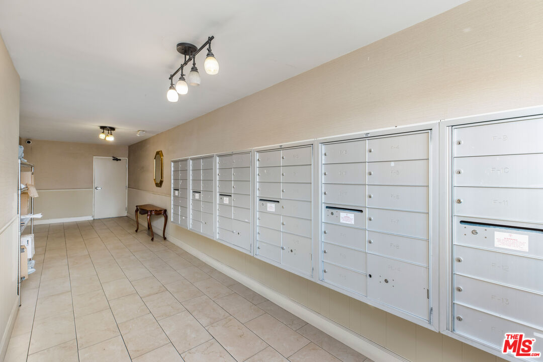 2385 Roscomare Road, Unit F4 Los Angeles, CA 90077 - Photo 40 of 57 a view of an empty room with cabinet and stairs