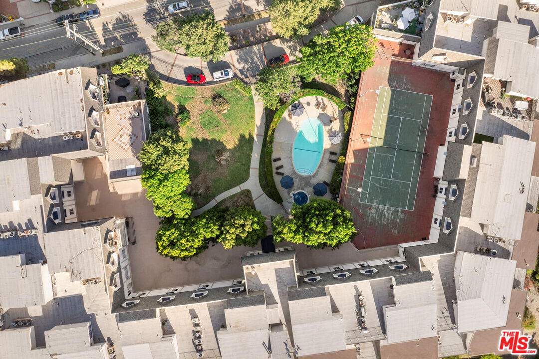 2385 Roscomare Road, Unit F4 Los Angeles, CA 90077 - Photo 45 of 57 an aerial view of a residential apartment building with a yard