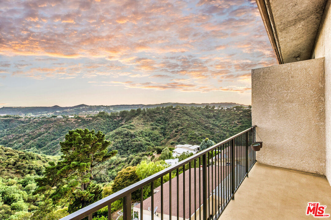 2385 Roscomare Road, Unit F4 Los Angeles, CA 90077 - Photo 50 of 57 a view of a balcony with an outdoor seating