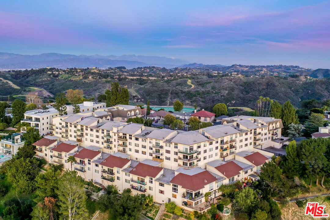 2385 Roscomare Road, Unit F4 Los Angeles, CA 90077 - Photo 56 of 57 a view of a city with lots of residential buildings and mountain view in back