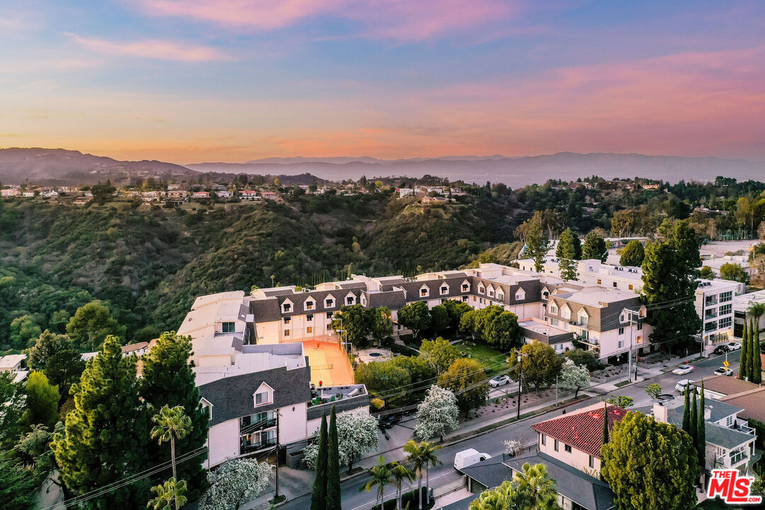 2385 Roscomare Road, Unit F4 Los Angeles, CA 90077 - Photo 57 of 57 an aerial view of a houses with a street