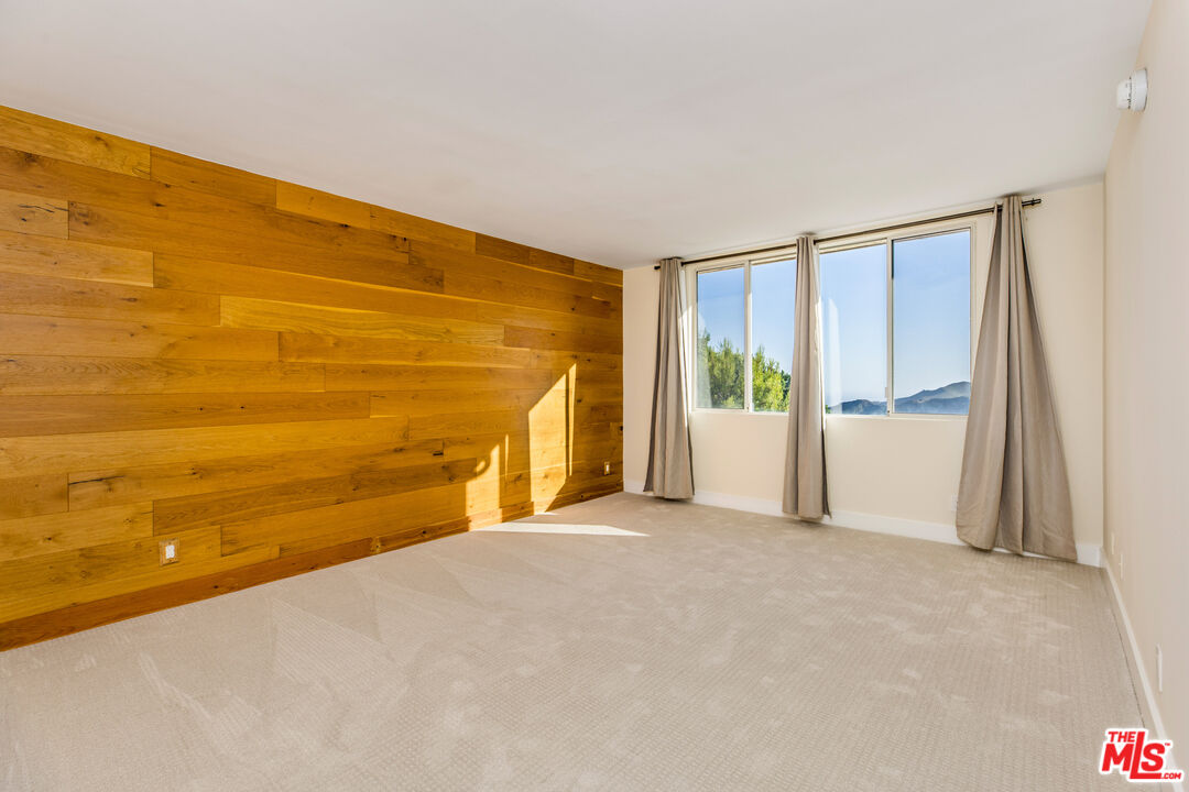 2385 Roscomare Road, Unit F4 Los Angeles, CA 90077 - Photo 6 of 57 a view of an empty room with a window