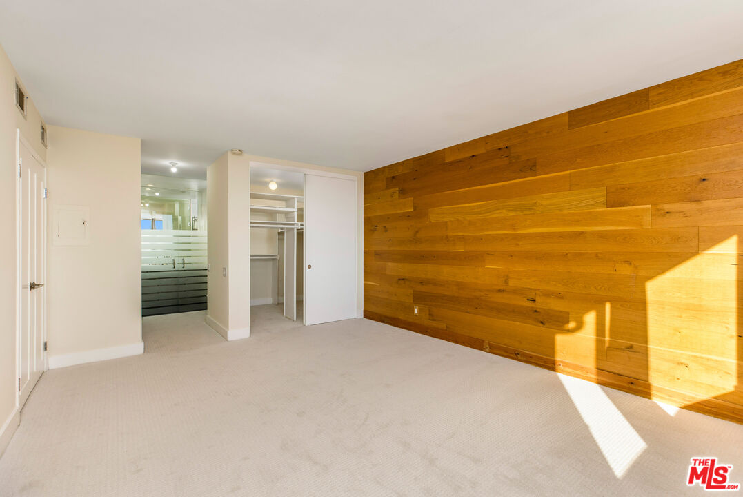 2385 Roscomare Road, Unit F4 Los Angeles, CA 90077 - Photo 8 of 57 a view of an empty room with a window