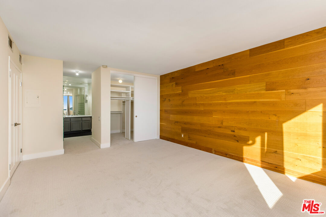 2385 Roscomare Road, Unit F4 Los Angeles, CA 90077 - Photo 9 of 57 a view of an empty room with a window