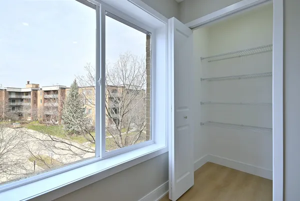 a view of a room has a large window