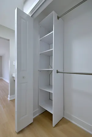 a view of an empty walk in closet
