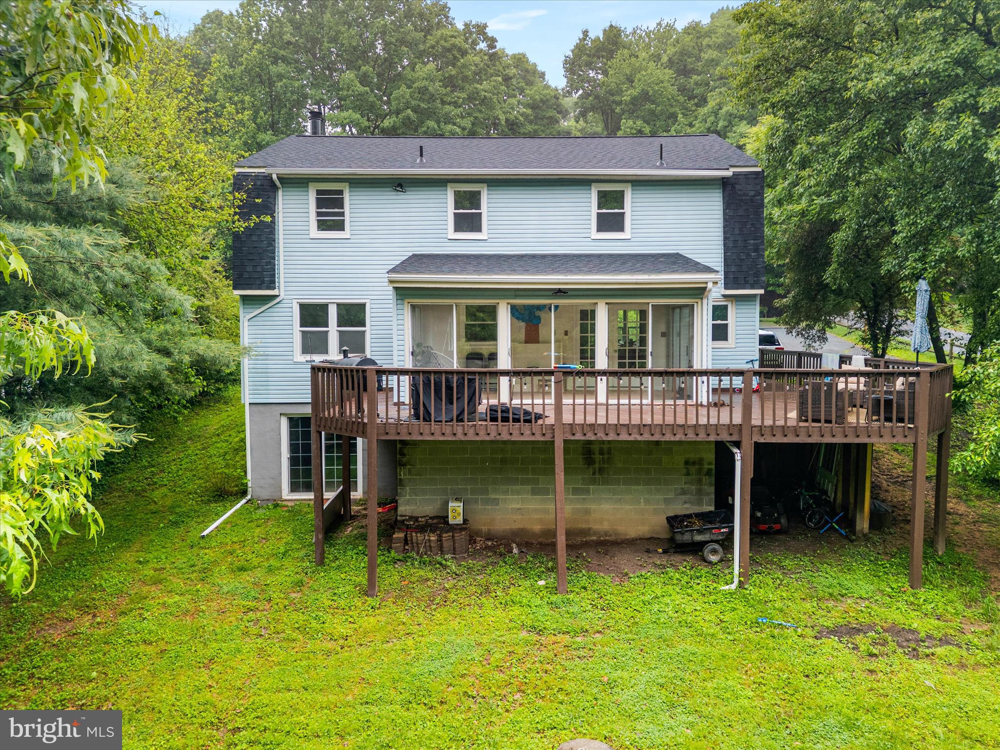 4217 Bill Moxley Road Mount Airy, MD 21771 - Photo 52 of 57 a backyard of a house with yard table and chairs