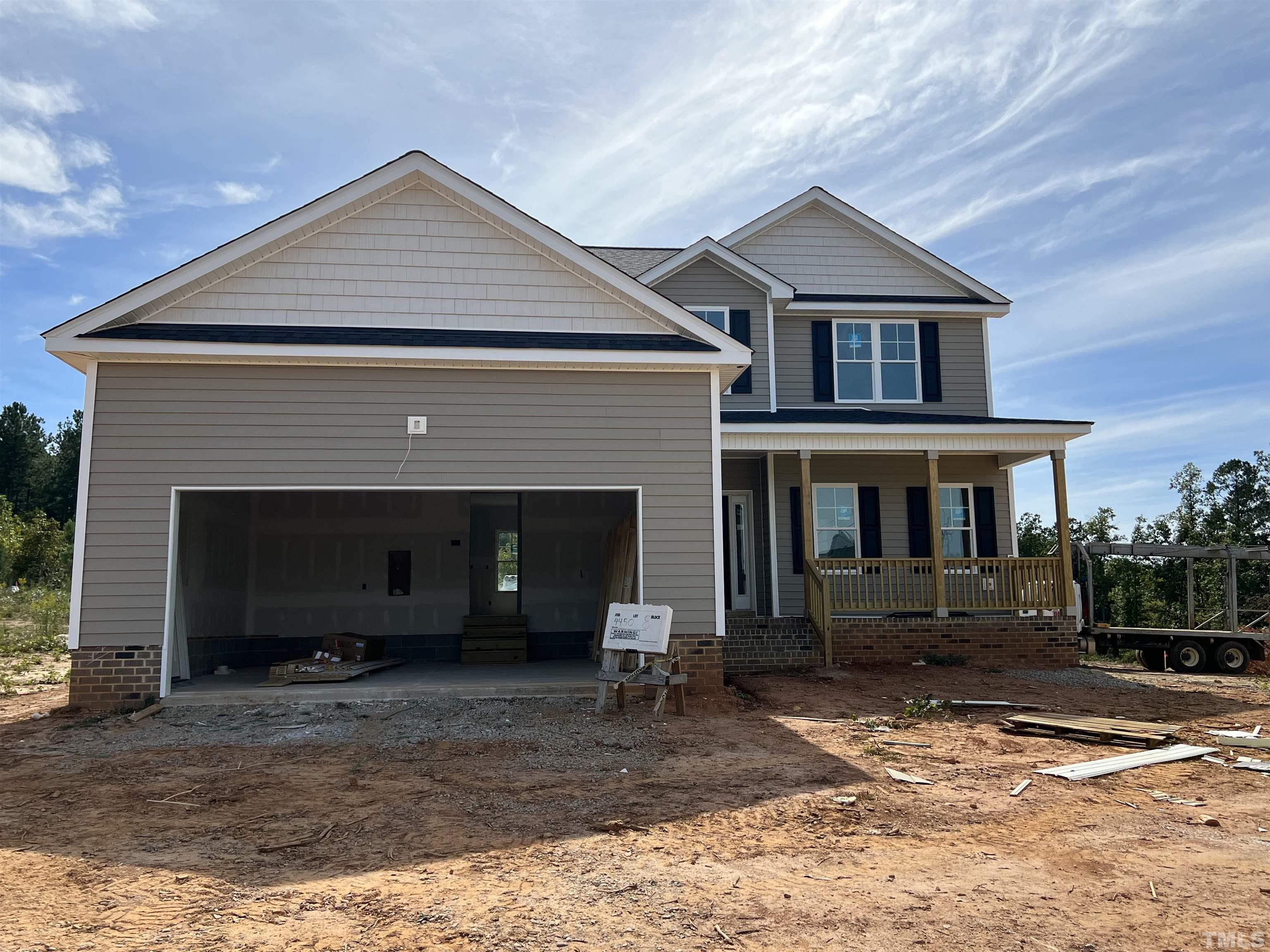 4450 Debnam Road Zebulon, NC 27597 - Photo 1 of 6 a front view of a house with a yard
