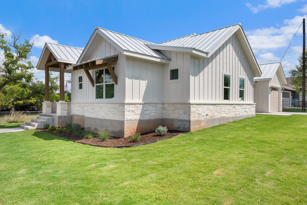 501 Ranchview Drive Johnson City, TX 78636 - Photo 9 of 28 a front view of a house with a yard and trees