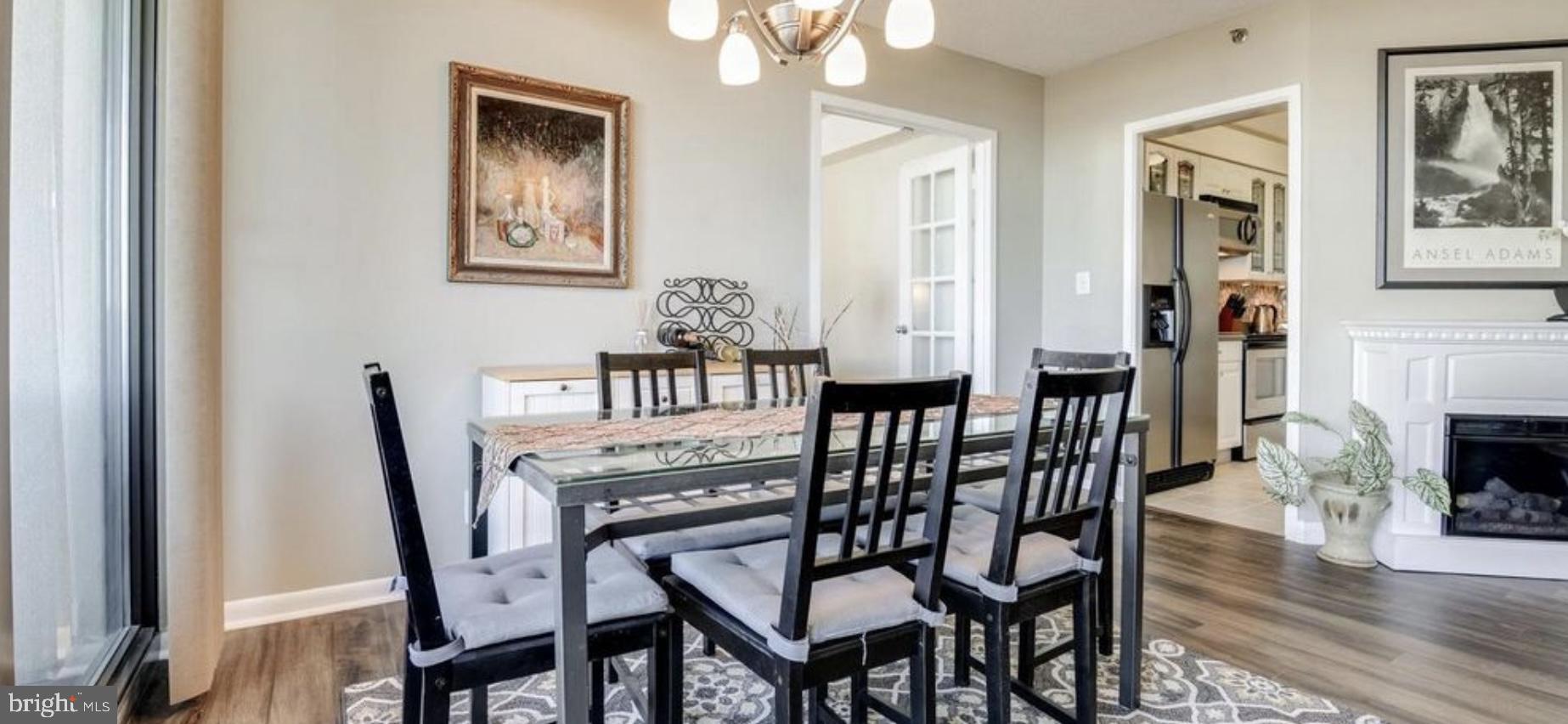 5505 Seminary Road, Unit 914N Falls Church, VA 22041 - Photo 17 of 29 a dining room with furniture and wooden floor