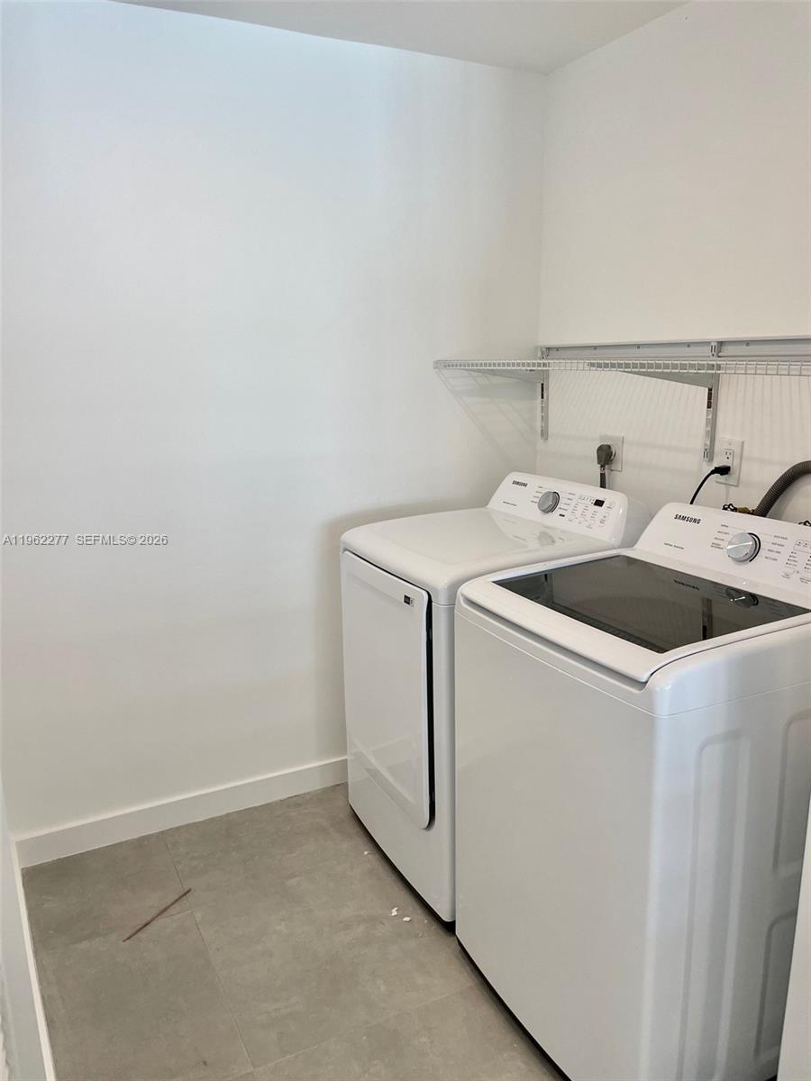 5701 Northwest 28th Street, Unit 13 Lauderhill, FL 33313 - Photo 11 of 34 a utility room with dryer and washer
