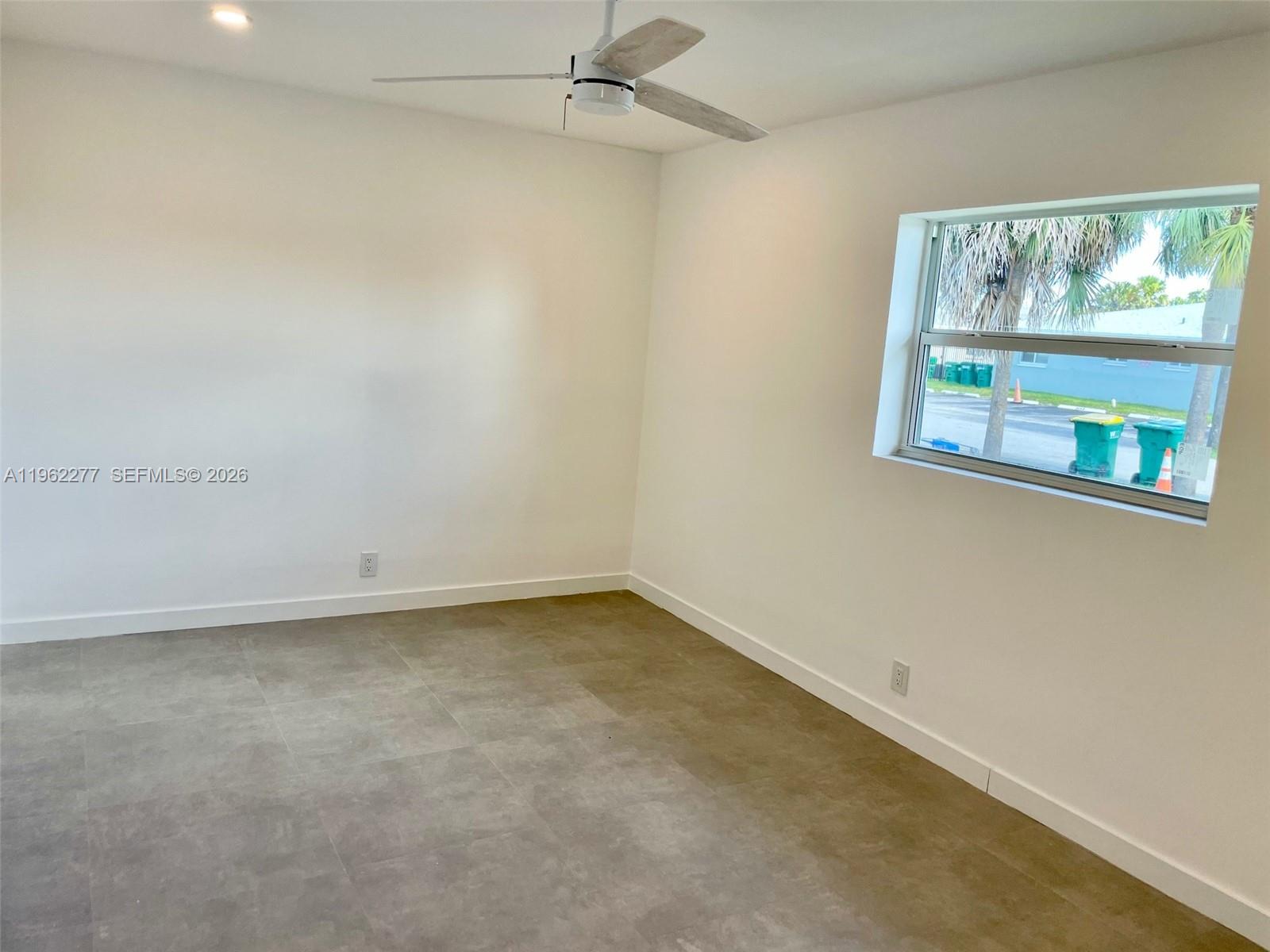 5701 Northwest 28th Street, Unit 13 Lauderhill, FL 33313 - Photo 13 of 34 an empty room with a window