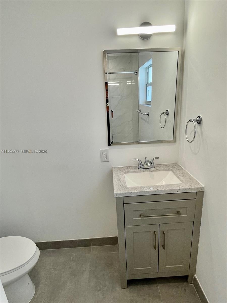 5701 Northwest 28th Street, Unit 13 Lauderhill, FL 33313 - Photo 20 of 34 a bathroom with a sink and a toilet