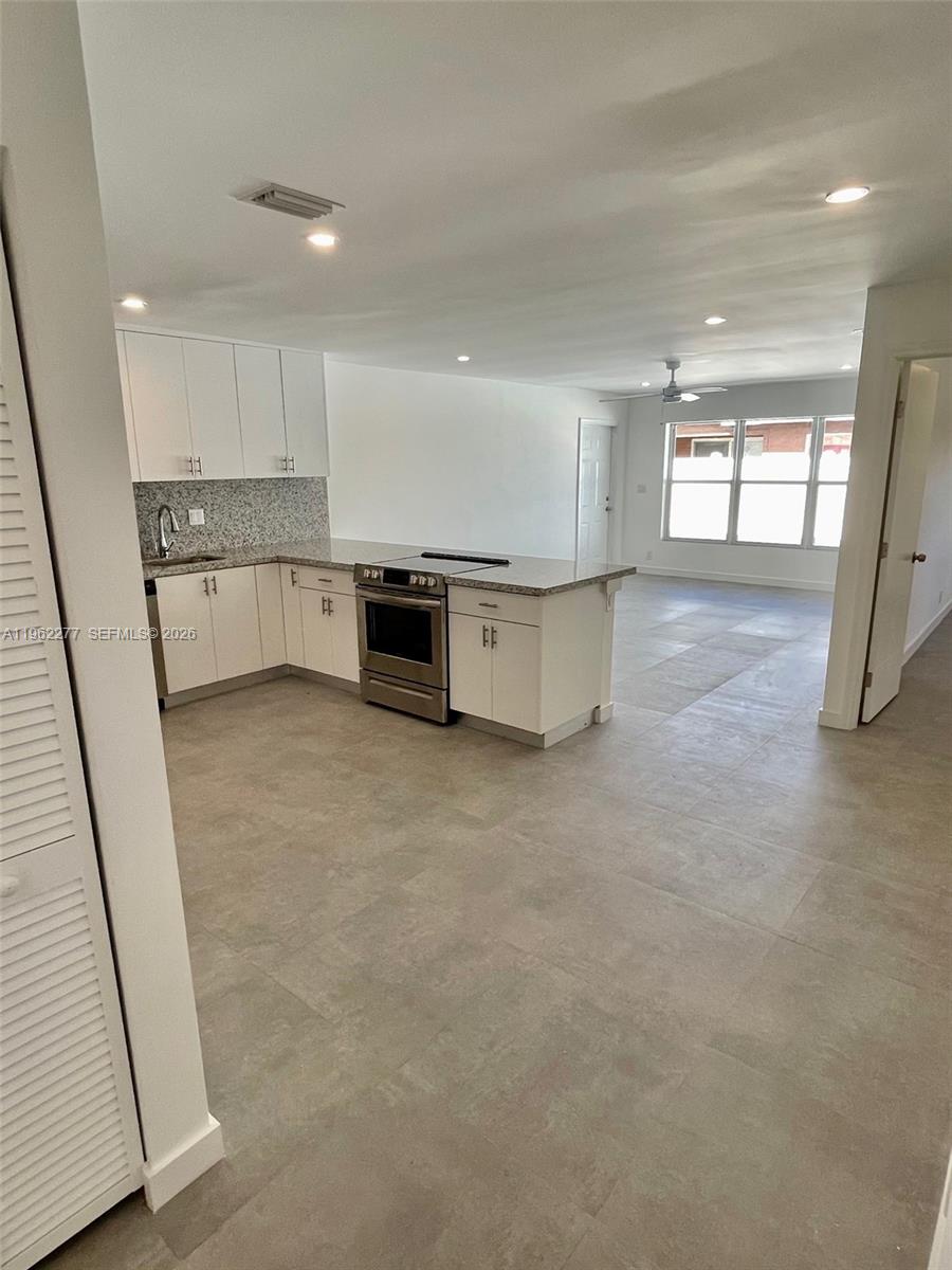 5701 Northwest 28th Street, Unit 13 Lauderhill, FL 33313 - Photo 21 of 34 a view of kitchen with stainless steel appliances refrigerator oven and cabinets