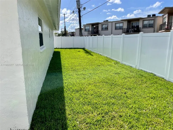 a backyard of a house with lots of green space