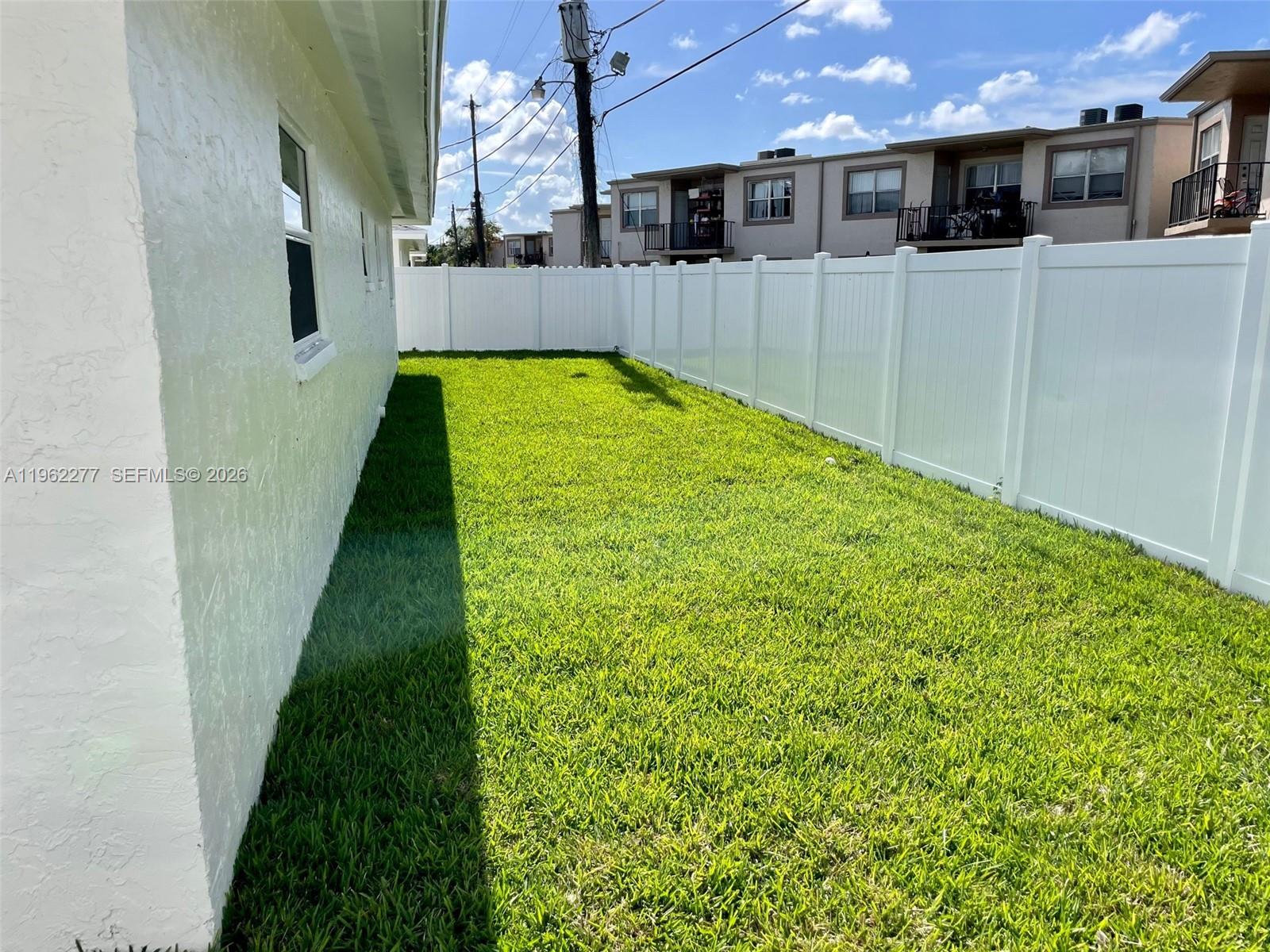 5701 Northwest 28th Street, Unit 13 Lauderhill, FL 33313 - Photo 27 of 34 a view of a swimming pool with an outdoor space