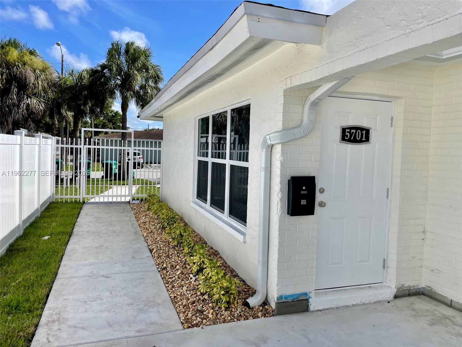5701 Northwest 28th Street, Unit 13 Lauderhill, FL 33313 - Photo 7 of 34 a view of a house with a large window