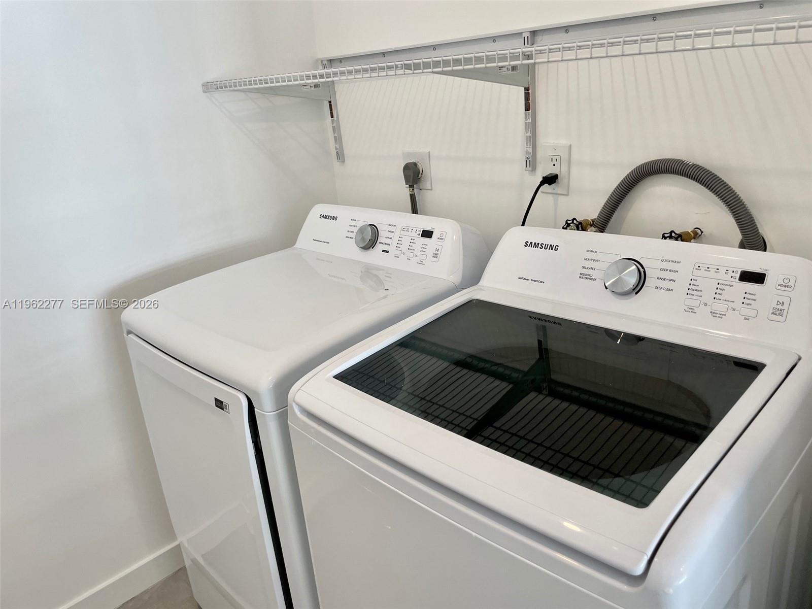 5701 Northwest 28th Street, Unit 13 Lauderhill, FL 33313 - Photo 10 of 34 a utility room with dryer and washer